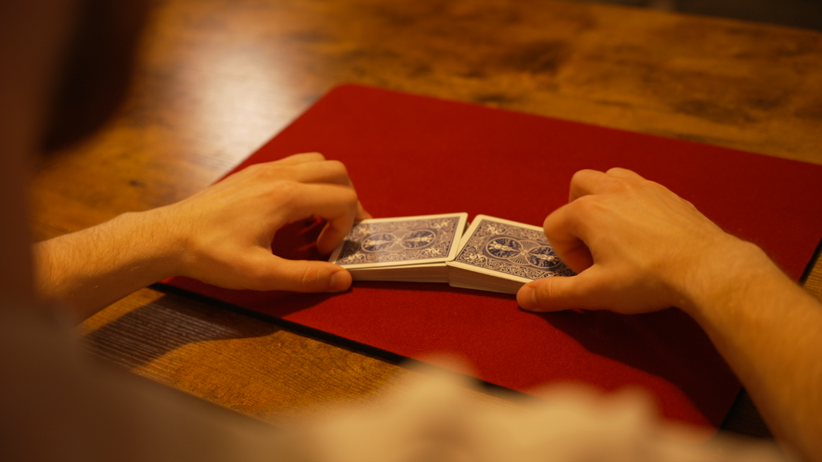 Benji and Jacob at the table with a deck of cards